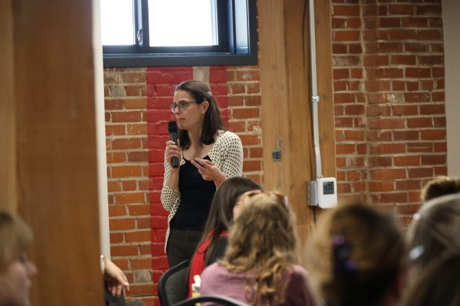 Dr. Sarah Halpern Meeking talking into a microphone